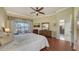 Spacious main bedroom featuring wood floors, slider to patio and sitting area at 4735 Starboard Dr, Bradenton, FL 34208