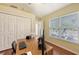 Office space featuring wood floors, natural light, and built-in closet at 4735 Starboard Dr, Bradenton, FL 34208