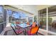 Covered patio featuring dining set and view of the swimming pool at 4735 Starboard Dr, Bradenton, FL 34208