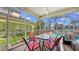 Screened patio featuring outdoor dining set and view of the pool at 4735 Starboard Dr, Bradenton, FL 34208