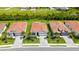 Aerial view of a single-story home with a tile roof, paver driveway and front yard landscaping at 491 Daylily Blvd, Nokomis, FL 34275
