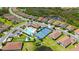 Aerial view of the neighborhood featuring a community pool, tennis and bocce ball courts at 491 Daylily Blvd, Nokomis, FL 34275