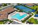 Aerial view of the resort pool, tennis courts, bocce ball and shuffle board courts offer community amenities for an active lifestyle at 491 Daylily Blvd, Nokomis, FL 34275