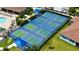 Aerial view of the tennis and pickle ball courts offer community amenities for an active lifestyle at 491 Daylily Blvd, Nokomis, FL 34275