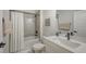 Well-lit bathroom features a shower-tub combo, a white vanity, and coordinated fixtures at 491 Daylily Blvd, Nokomis, FL 34275