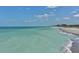 Expansive view of the coastline featuring turquoise waters and a sandy beach on a sunny day at 491 Daylily Blvd, Nokomis, FL 34275