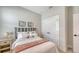 Charming bedroom featuring a designer headboard, side tables, and a comfortable bed with stylish bedding at 491 Daylily Blvd, Nokomis, FL 34275