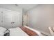 Bright bedroom with closet, a comfortable bed with stylish bedding, and a neutral color palette at 491 Daylily Blvd, Nokomis, FL 34275