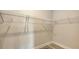 Walk-in closet with custom shelving providing ample storage space and organization, creating a neat and tidy space at 491 Daylily Blvd, Nokomis, FL 34275