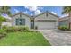 Charming single-story home with well-manicured lawn, tile roof and paver driveway at 491 Daylily Blvd, Nokomis, FL 34275