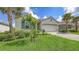 Charming single-story home with well-manicured lawn, tile roof and paver driveway at 491 Daylily Blvd, Nokomis, FL 34275
