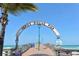 Scenic view of the Venice Fishing Pier entrance with clear blue skies at 491 Daylily Blvd, Nokomis, FL 34275