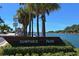 Entrance to Humphris Park with sign, lush greenery, and waterway views under a clear blue sky at 491 Daylily Blvd, Nokomis, FL 34275