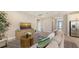 Stylish living area boasts a comfortable sofa, modern décor, and open layout to the kitchen and dining area at 491 Daylily Blvd, Nokomis, FL 34275