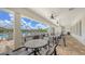 Clubhouse patio featuring tables, chairs, and views of the community pool at 491 Daylily Blvd, Nokomis, FL 34275