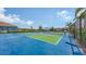 Community pickle ball courts with shade canopies and landscaping at 491 Daylily Blvd, Nokomis, FL 34275