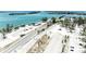 Aerial image highlighting a roadside park with play area and bridge in the background at 5415 13Th Avenue W Dr, Bradenton, FL 34209