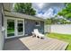 Inviting back deck with sliding glass doors and a lounge chair to enjoy the outdoors at 5415 13Th Avenue W Dr, Bradenton, FL 34209