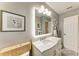 Bathroom features a vanity with a marble countertop, an LED mirror, and gray walls at 5415 13Th Avenue W Dr, Bradenton, FL 34209