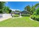 Charming single-story home with a well-manicured lawn and lovely front yard landscaping at 5415 13Th Avenue W Dr, Bradenton, FL 34209