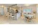 Modern kitchen with stone countertops, stainless steel appliances, and a breakfast bar at 5415 13Th Avenue W Dr, Bradenton, FL 34209