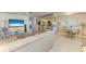 Open-concept layout combining living and dining areas, with a neutral color palette and ample natural light at 5415 13Th Avenue W Dr, Bradenton, FL 34209