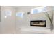 Bathroom with walk-in shower, a modern tub and cozy fireplace at 5630 Inspiration Ter, Bradenton, FL 34210