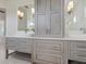 Bathroom with double vanity, marble counters, and plenty of storage space at 5630 Inspiration Ter, Bradenton, FL 34210
