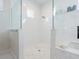 Modern bathroom showcasing a walk-in shower with sleek glass enclosure and decorative tile at 5630 Inspiration Ter, Bradenton, FL 34210