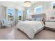 Inviting bedroom with cozy bedding, stylish accents, and plenty of natural light at 5630 Inspiration Ter, Bradenton, FL 34210