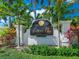 Welcoming 'Legends Bay' community sign amidst lush landscaping and palm trees at 5630 Inspiration Ter, Bradenton, FL 34210