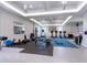 Well-equipped home gym with various exercise machines and ample space for workouts at 5630 Inspiration Ter, Bradenton, FL 34210