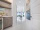 Hallway featuring a bar area and views into the main living area of the home at 5630 Inspiration Ter, Bradenton, FL 34210
