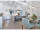 Bright kitchen showcasing white cabinetry, a large island with seating, and modern stainless steel appliances at 5630 Inspiration Ter, Bradenton, FL 34210