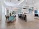 Open-concept kitchen and dining area, showcasing modern design, stainless steel appliances, and comfortable seating at 5630 Inspiration Ter, Bradenton, FL 34210