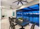 An outdoor patio has dining and lounge seating, with views of the natural landscape at 5630 Inspiration Ter, Bradenton, FL 34210