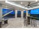 A modern lanai features a bar table, lounge seating, and open views at 5630 Inspiration Ter, Bradenton, FL 34210