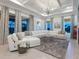Spacious living room featuring large windows, plush seating, and a stylish coffee table at 5630 Inspiration Ter, Bradenton, FL 34210