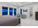 Spacious main bedroom with tile flooring, comfortable seating, and a view of the pool and lake at 5630 Inspiration Ter, Bradenton, FL 34210