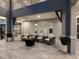 A spacious patio area includes outdoor seating, a fire pit, and landscape views at 5630 Inspiration Ter, Bradenton, FL 34210