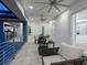 A covered patio with outdoor furniture and ceiling fans offers a relaxing outdoor space at 5630 Inspiration Ter, Bradenton, FL 34210