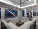 Screened-in patio featuring a seating area with sleek furniture and tiled flooring at 5630 Inspiration Ter, Bradenton, FL 34210