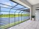 Enjoy panoramic water and nature views from this spacious screened-in lanai at 5630 Inspiration Ter, Bradenton, FL 34210