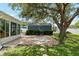 Backyard featuring a bench, shed, stepping stones, and beautiful mature tree at 5685 36Th N Ave, St Petersburg, FL 33710