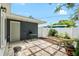 Charming backyard featuring a stone-paved patio, small table, and access door at 5685 36Th N Ave, St Petersburg, FL 33710