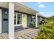 Close up of front entrance features a sunny yellow front door and walkway at 5685 36Th N Ave, St Petersburg, FL 33710
