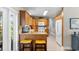 Bright eat-in kitchen with tile floors, light cabinets, and stainless steel appliances at 5685 36Th N Ave, St Petersburg, FL 33710