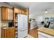 Kitchen featuring granite countertops, white refrigerator, and light wood cabinets at 5685 36Th N Ave, St Petersburg, FL 33710