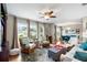 Bright living room featuring hardwood floors, comfortable seating, and access to dining room at 5685 36Th N Ave, St Petersburg, FL 33710