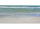 Beach scene featuring clear water and sandy shore on a sunny day at 571 Birdie Ln, Longboat Key, FL 34228